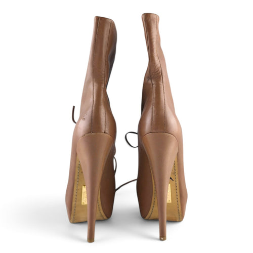 FuzzBeez Alejandro Ingelmo tan leather stiletto platform booties with high heels viewed from the back