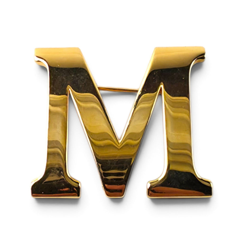 FuzzBeez vintage Anne Klein gold-tone letter M monogram brooch pin with a polished finish and rollover safety clasp.