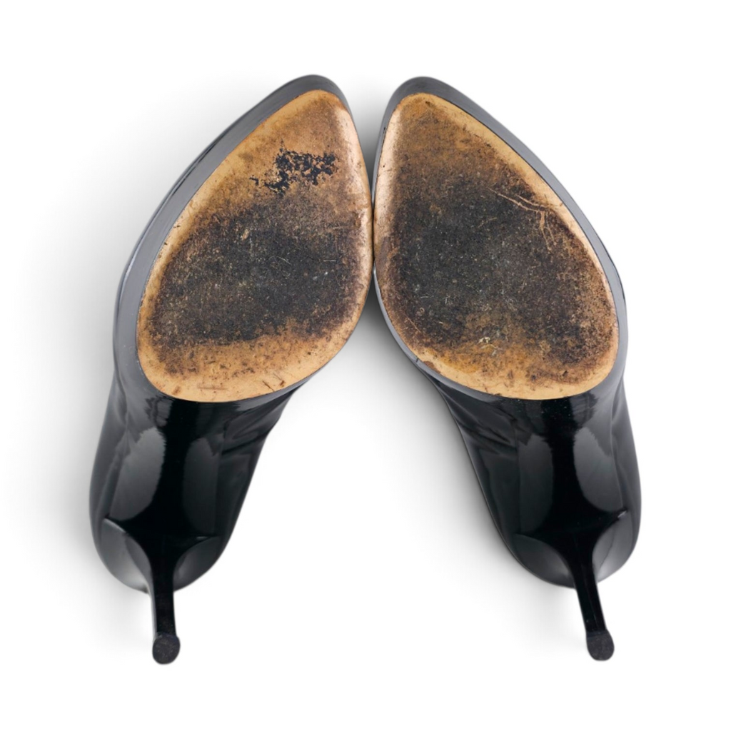 FuzzBeez Casadei black patent leather platform stiletto pumps viewed from the worn leather soles