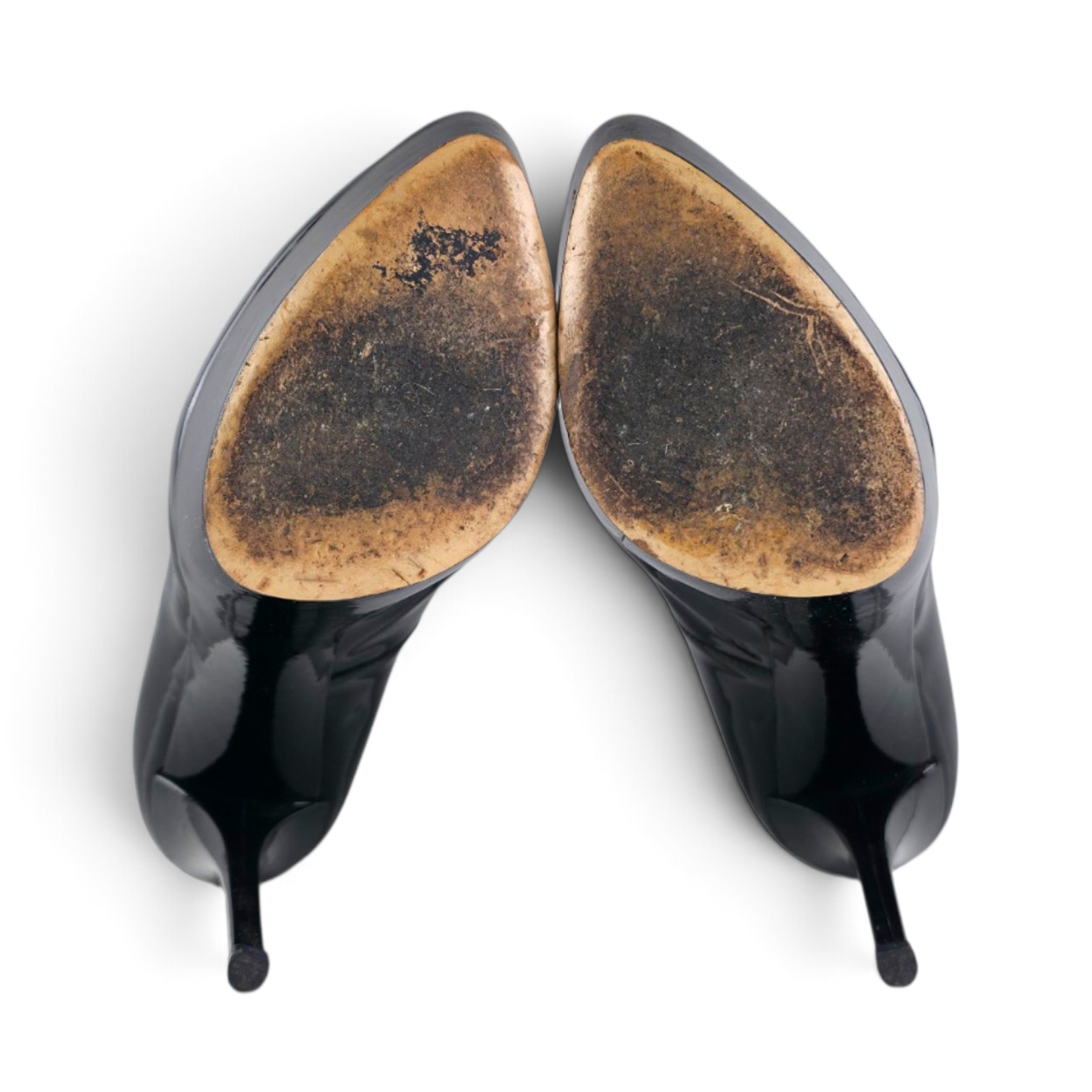FuzzBeez Casadei black patent leather platform stiletto pumps viewed from the worn leather soles