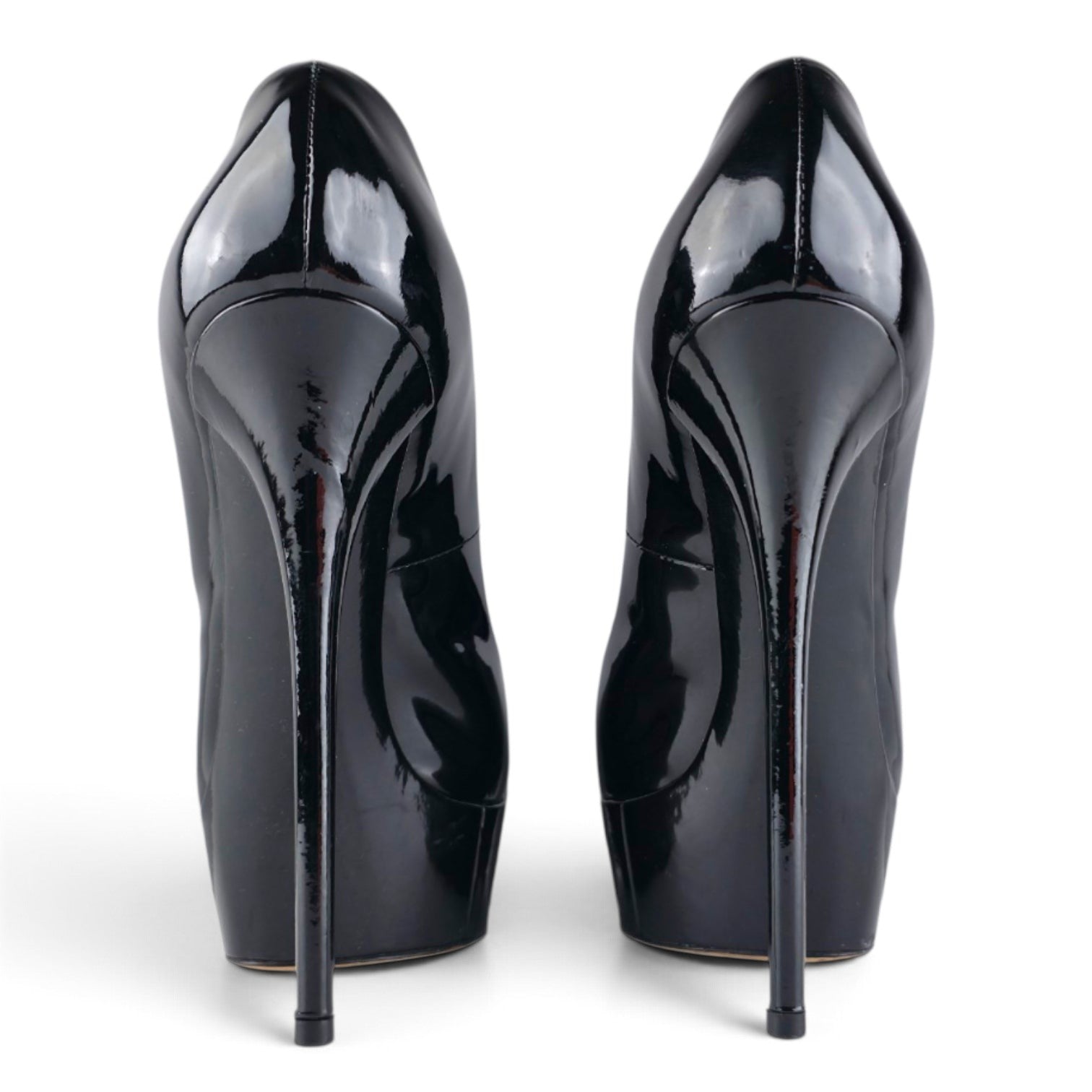 FuzzBeez Casadei black patent leather platform stiletto pumps seen from the back showing high heels
