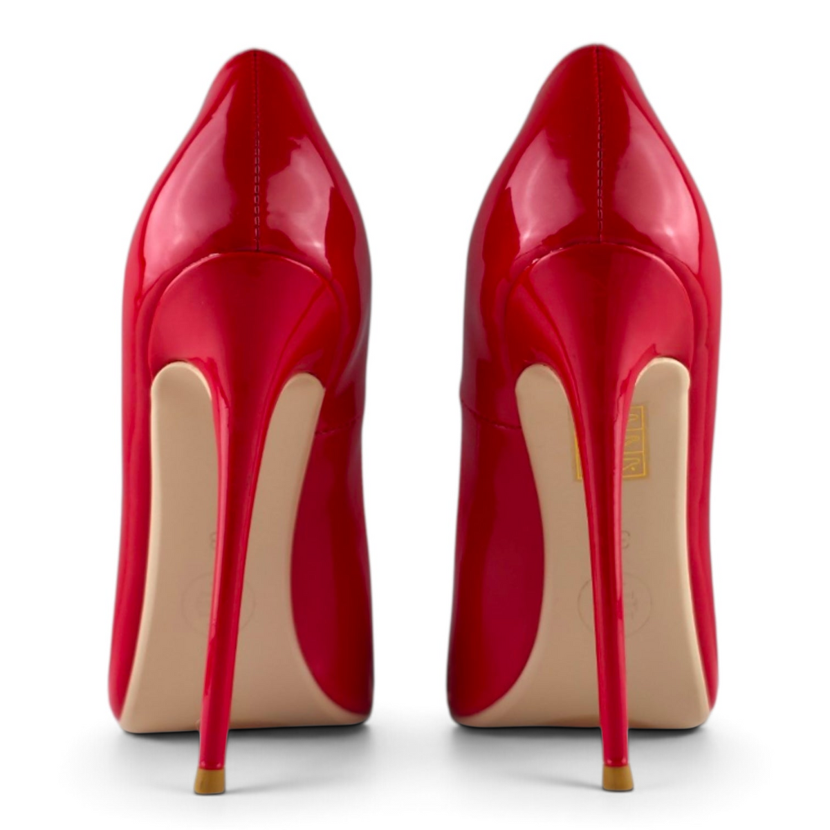 FuzzBeez cherry red patent vegan leather stiletto pumps with 5-inch heels, shown from the back view.