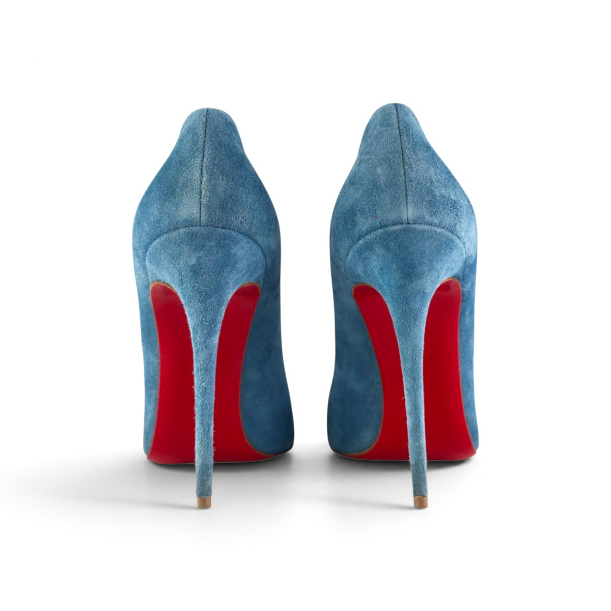 FuzzBeez Christian Louboutin Pigalle Follies 100 pumps in celeste blue suede with signature red lacquered soles.