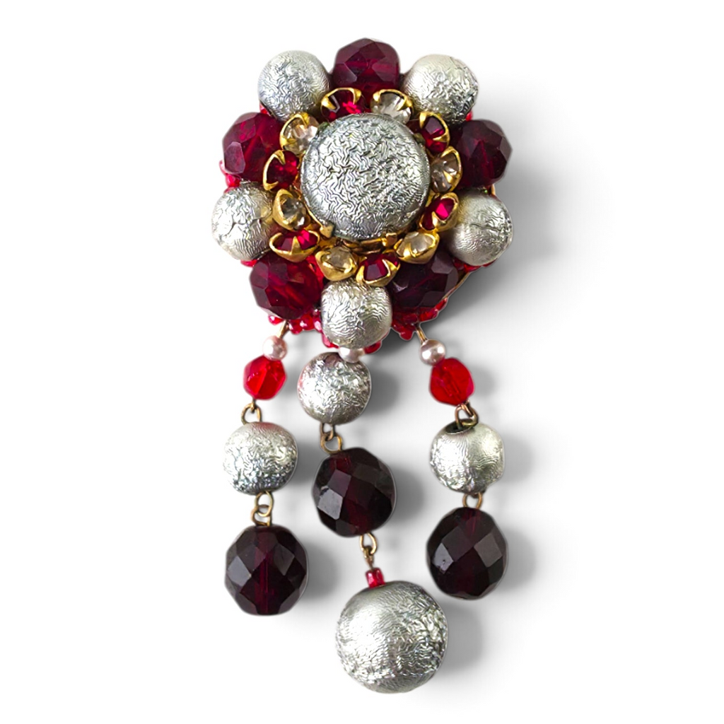 FuzzBeez vintage statement brooch featuring crimson red faceted glass and textured silver beads with dangle accents.