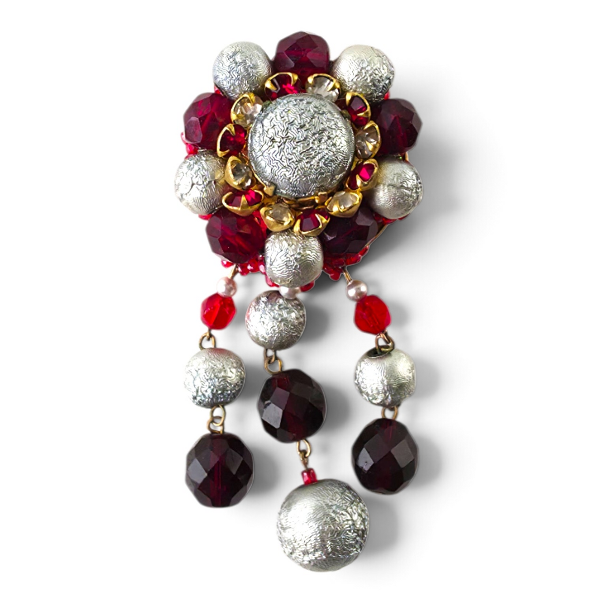 FuzzBeez vintage statement brooch featuring crimson red faceted glass and textured silver beads with dangle accents.