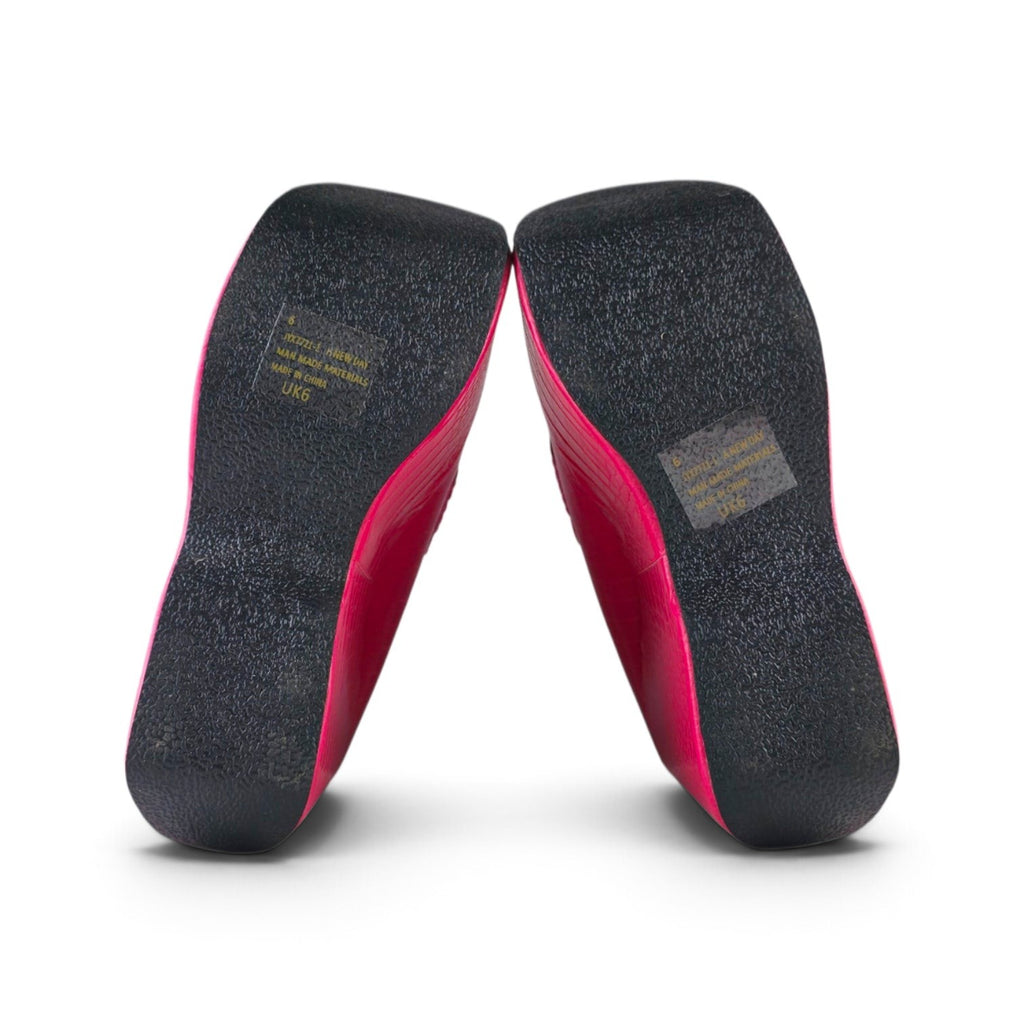 FuzzBeez EGO hot pink croc platform wedge loafers showing the black textured soles and size labels