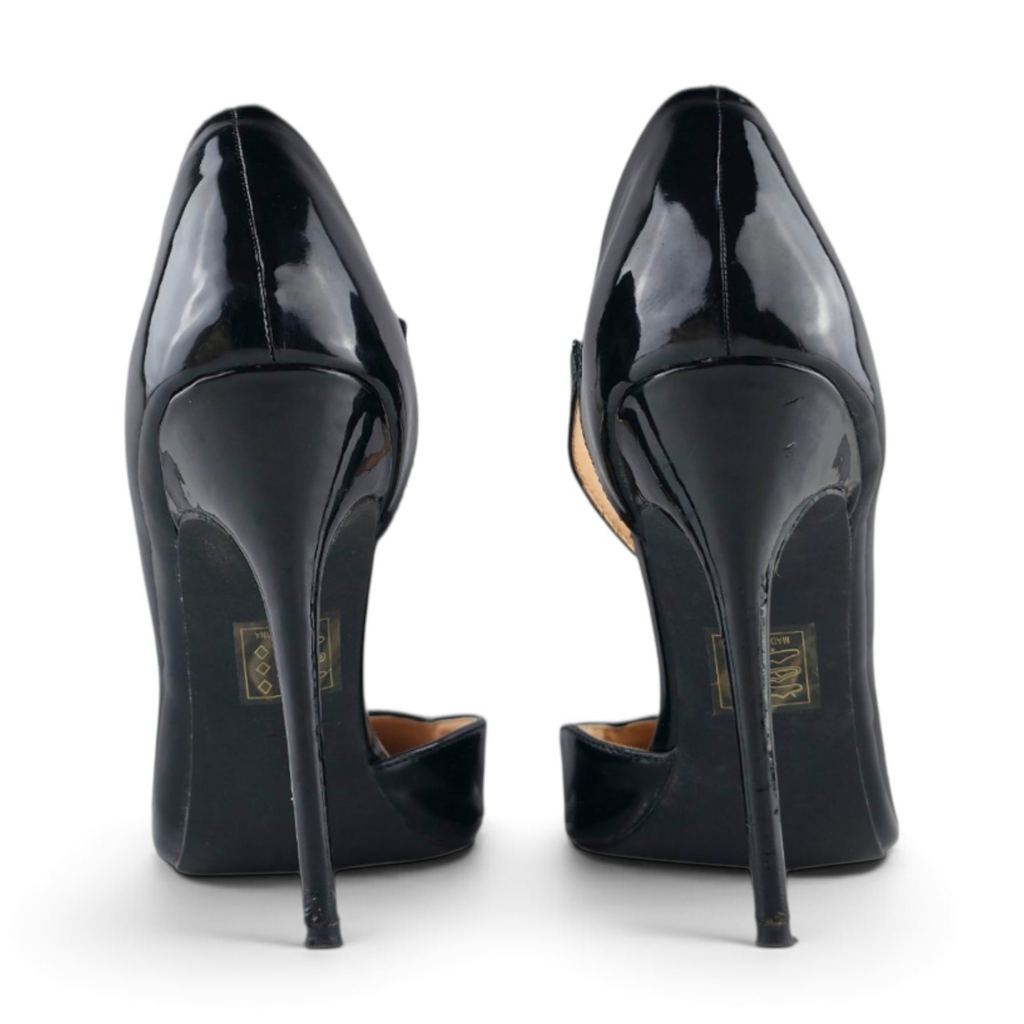 FuzzBeez Fashion Nova black patent faux leather stiletto pumps with asymmetrical strap and pointed toe, back view
