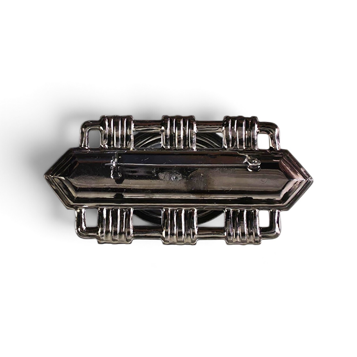 Back view of FuzzBeez Art Deco gunmetal brooch showing the metal frame and secure rollover safety clasp.