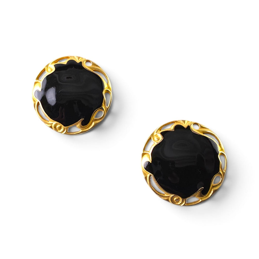 FuzzBeez vintage LIA round clip-on earrings featuring glossy black enamel centers and ornate gold-tone metal frames.