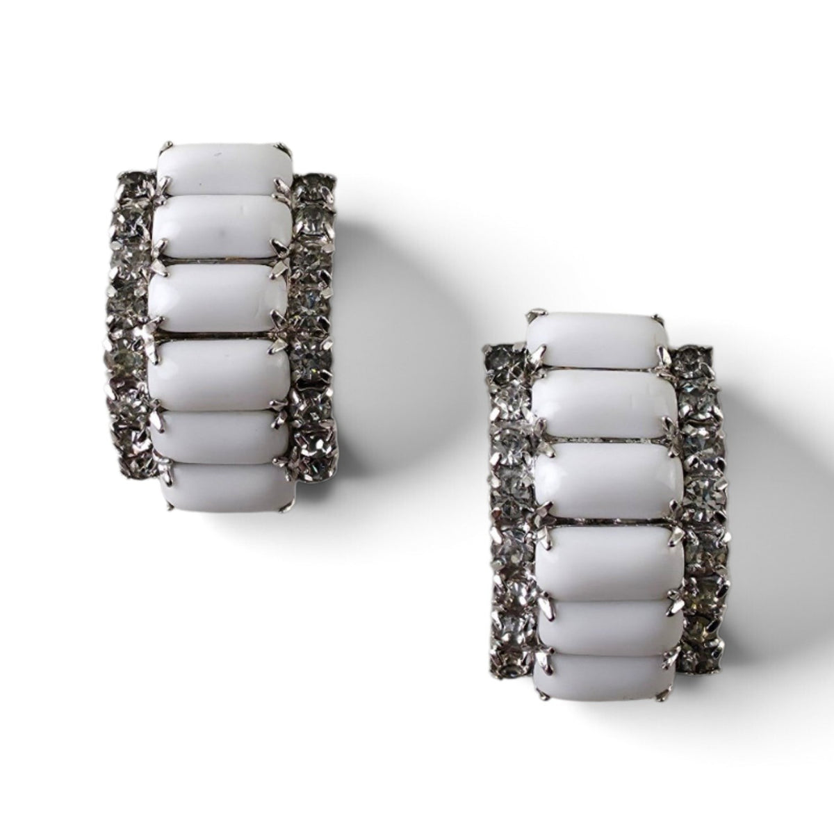 FuzzBeez vintage J-hoop clip-on earrings featuring white milk glass cabochons and clear rhinestones in silvertone settings.