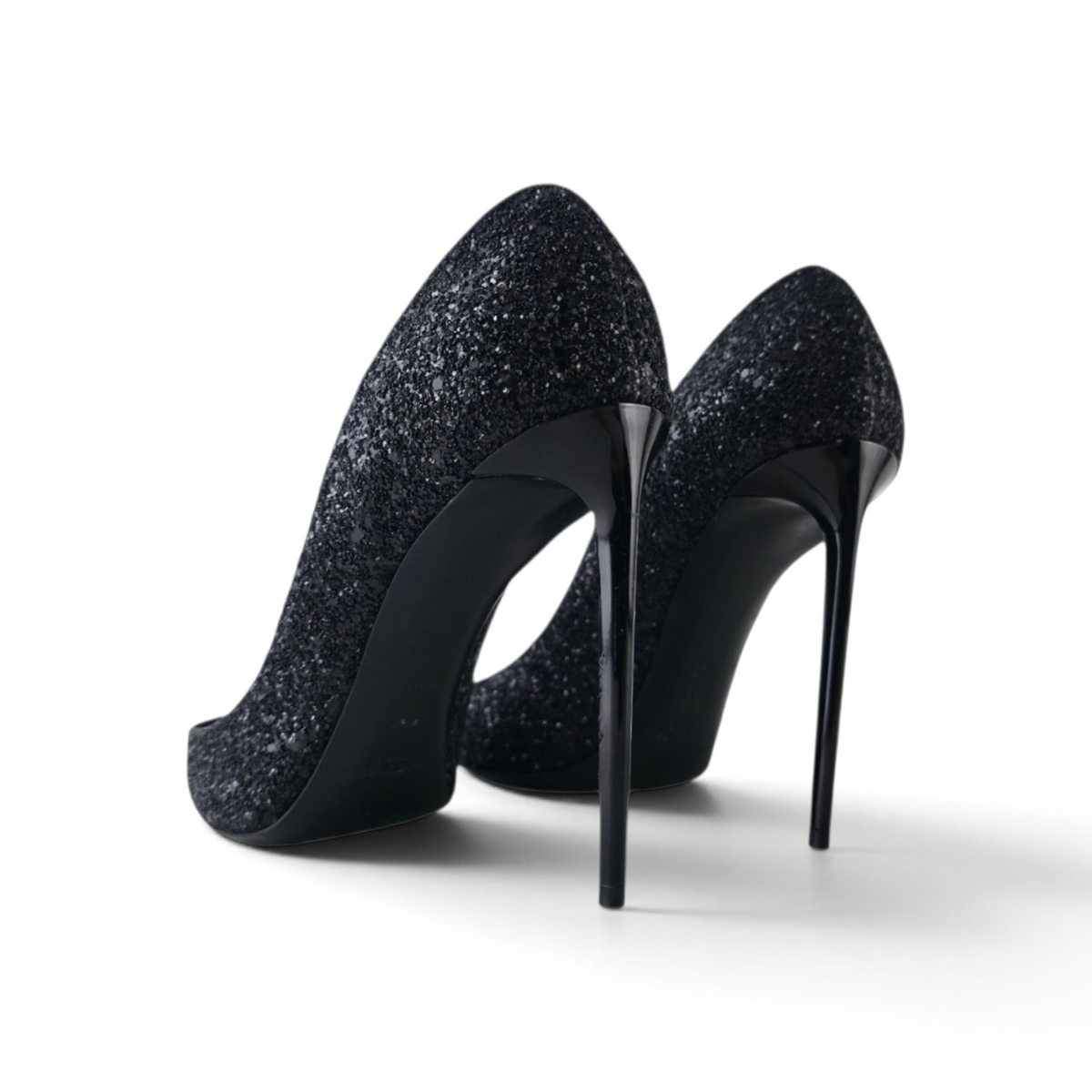 FuzzBeez Saint Laurent black glitter stiletto pumps with high-gloss heels shown from the back