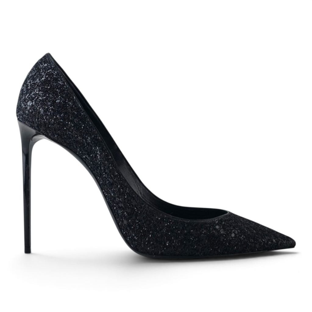 FuzzBeez Saint Laurent Zoe black glitter pointed toe stiletto pumps with high-gloss heels in a side profile view.