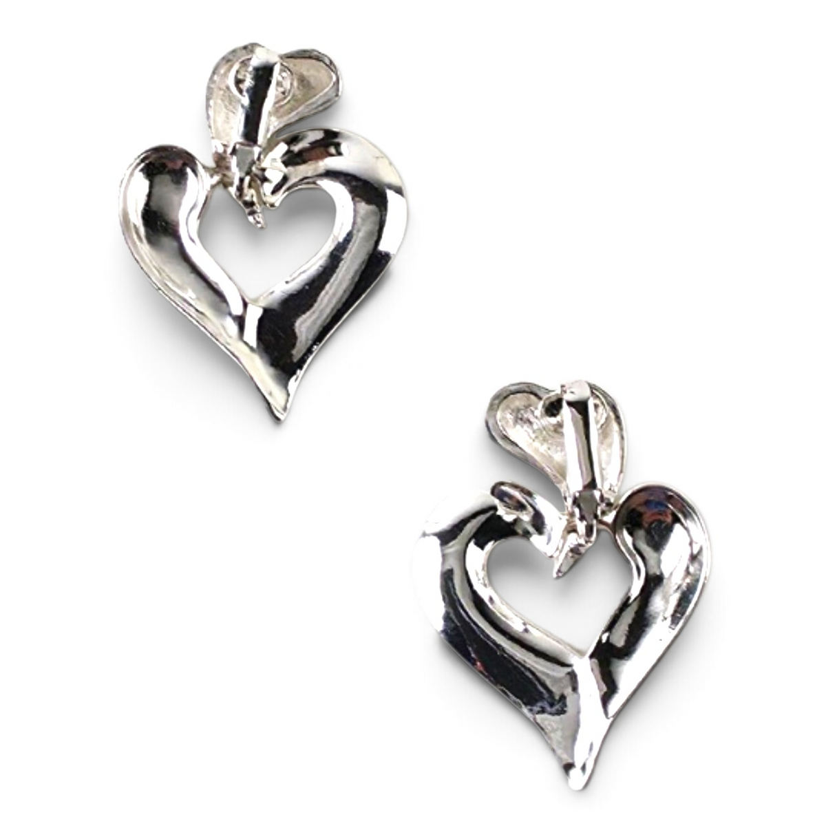 FuzzBeez vintage silver-tone modernist open heart dangle clip-on earrings with abstract polished metal design.