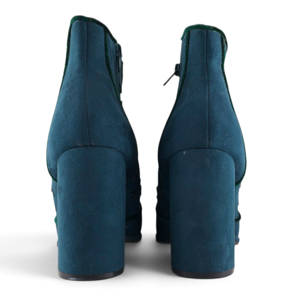 FuzzBeez Cloudwalkers teal blue faux suede ankle boots with chunky block heels and dark velvet trim, rear view.