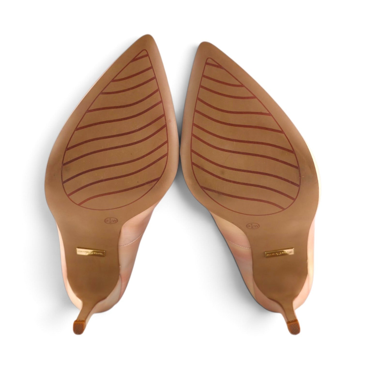 FuzzBeez Torta Caliente rose gold metallic stiletto pumps showing the non-slip wave grip rubber outsoles