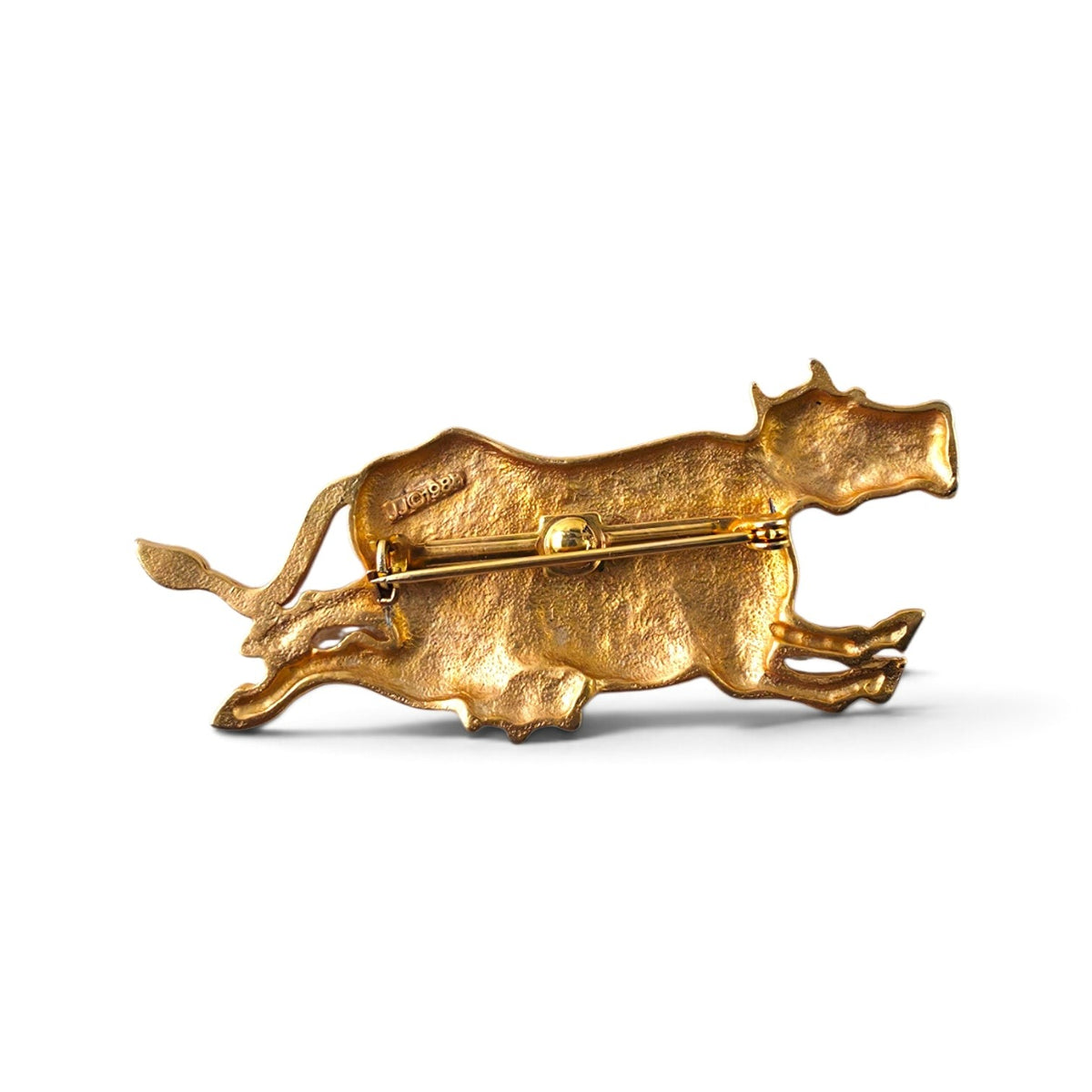 FuzzBeez vintage 1988 JJ matte gold-tone running cow brooch pin showing the back with locking bar clasp